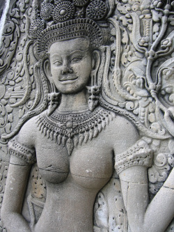 Sculpture of a topless Cambodian woman, by