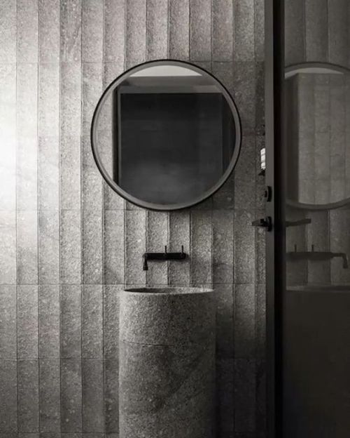 thedesignwalker: Cool #bathroom with a #grey #stone cladding and #freestanding #washbasin