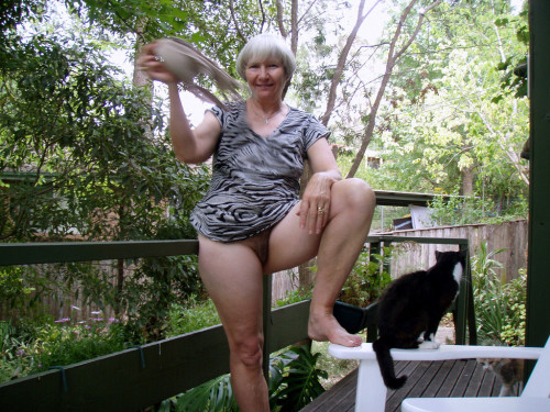 jemcasey:  Lyn, our lovely Australian granny gets naked on the deck…   Who could resist bending her over that rail and giving her hairy cunt a thorough drilling? Even though pussy seems indifferent to mistress’s charms!