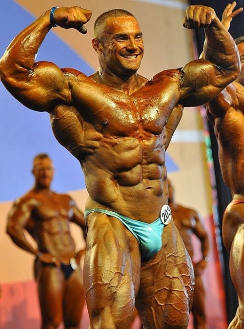 sannong:    Tomas Kaspar - Part 1: Stage Shots. Holy fuck! The bulging road map veins covering every inch of his beautifully mutated legs, the monstrous, deeply striated and ripped traps, the shredded sucked in bodybuilder face that just scream raw power.