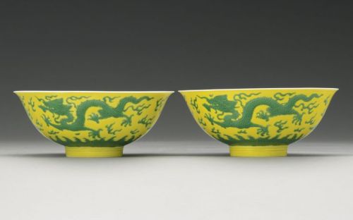 A yellow-ground green-enameled dragon foliate dish and bowls. Qianlong seal mark, Qianlong period