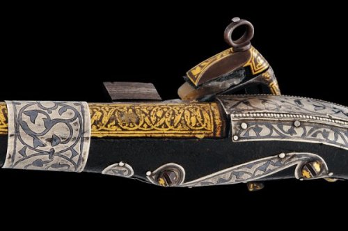 A gold and silver decorated Cossack&rsquo;s miquelet pistol, 19th century.