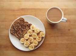 garden-of-vegan:  sprouted grain toast with swirled almond butter and chocolate on one slice, and peanut butter, banana, and cinnamon on the other, with coffee with soy milk 