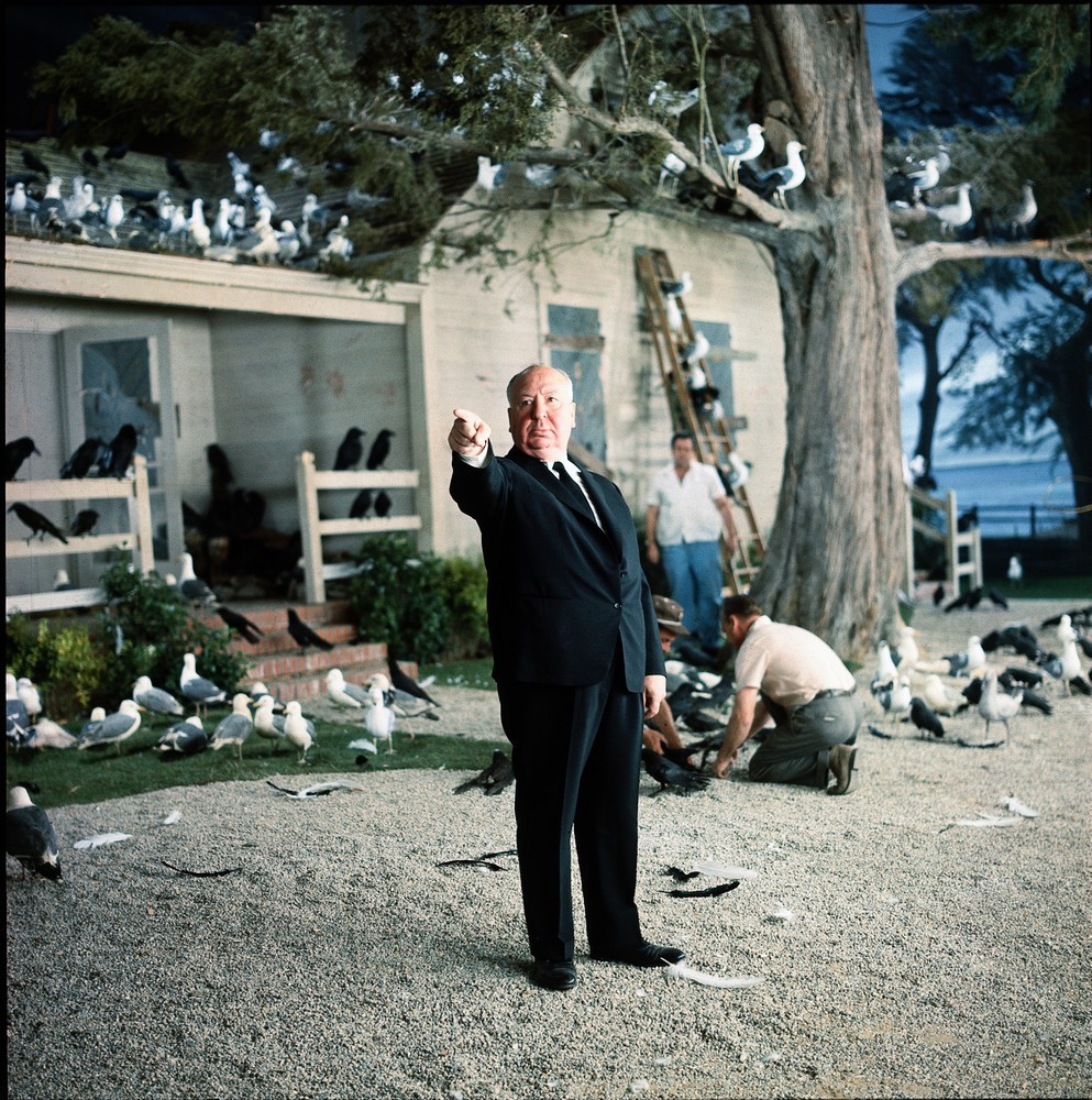 Director Alfred Hitchcock, behind the scenes on the set of The Birds