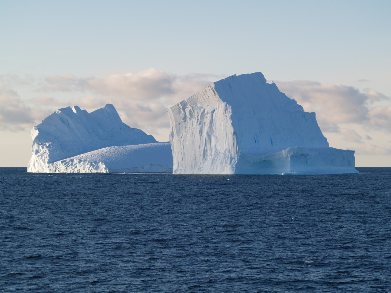 Icebergsin the Ross Sea (Antarctica, January 23rd,2006).Aniceberg is a ...