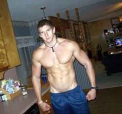 texasfratboy:  damn, this is one big muscle boy!!  And with his shorts so low, we can even see the beginning of some pubes.  hot! 