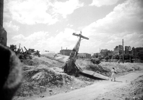 historicaltimes:The civilians look at the German fighter Messerschmitt Bf.109 shot down and attempte