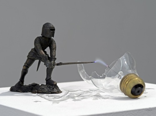 unicorn-meat-is-too-mainstream:  Overpower is a creative little sculpture that portrays a battle between a Medieval knight and a modern lightbulb. Created by artist Michel de Broin, the small bronze statue is mid-swing with a sword that seems to have