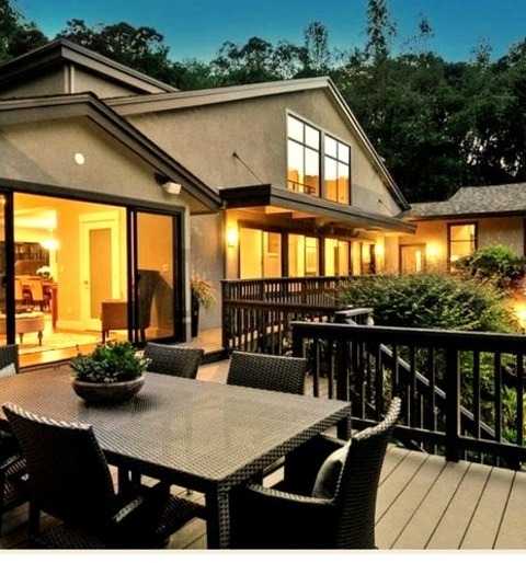 Stucco ExteriorLarge Transitional Gray Two-story Stucco House Exterior Photo With A Shed Roof And A Shingle