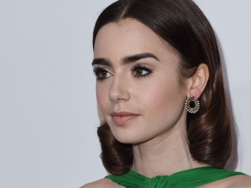 lilycollinsnews: Lily Collins attends the 28th Annual Producers Guild Awards at The Beverly Hilton H