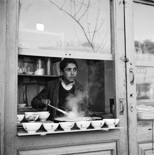 vintage-iran: A street stall in Tehran, Iran sells bowls of soup - 1952.