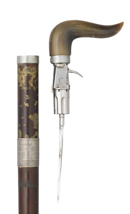 A rare French walking cane with hidden pepperbox revolver and dagger.  Presented to George Soule by 