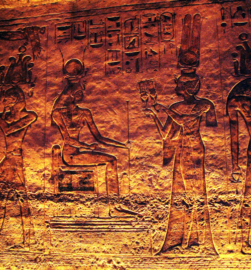 Nefertari offering sistrums to the seated goddess Hathor in the smaller temple at Abu Simbel, 19th d