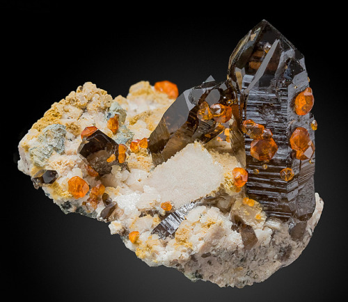 Spessartine Garnet atop Smoky QuartzLocality: Wushan Spessartine Mine, Tongbei, Yunxiao Co., Zhangzh