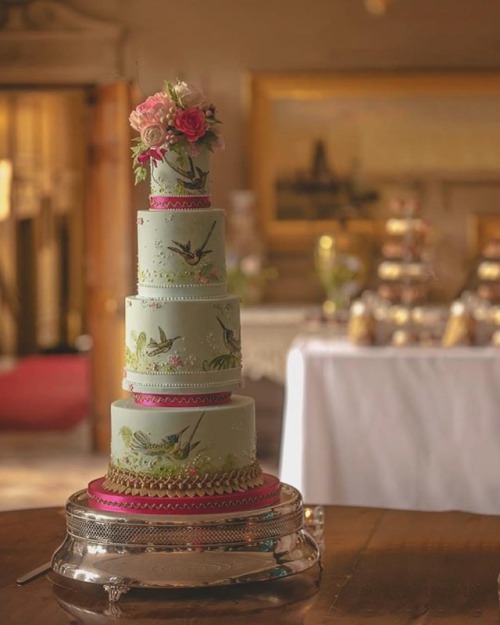 A rather pretty wedding cakes with hand painted birds to match the spring/ floral theme at this wedd