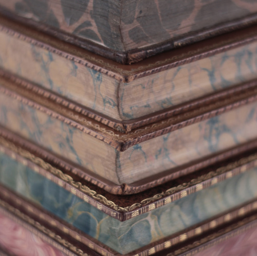 michaelmoonsbookshop:leather bound 19th century books with marbled page edges and gilt details