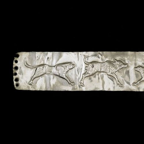 whencyclopedia: Persian Silver Plaque Depicting Hunting Dogs Perforated silver plaque; lightly embos