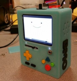 rvidxr-nxvh:  flowersinmydreads:  nerdsandgamersftw:A Working BMO Super Nintendo Emulator3D print designer Mike Barretta built this amazing BMO emulator using an assortment of 3D printed pieces and Super Nintendo buttons, as well as a mixture of electroni