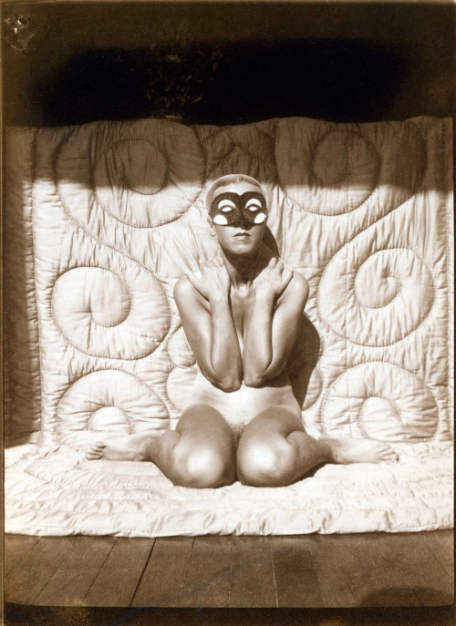 hauntedbystorytelling: Claude Cahun :: Self portrait, [kneeling, naked, with mask], ca. 1928 more [+
