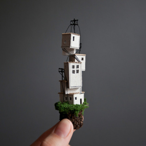 archatlas:  Miniature Houses on Cork Cliffs Float Inside Handmade Wooden Frames by Rosa de Jong  Designer Rosa de Jong produces micro homes that are built into the side of tiny cliffs constructed out of cork. Her miniature environments are covered in