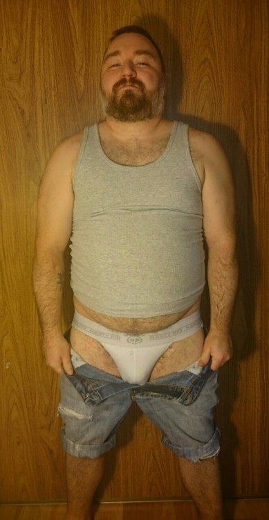 cuddlecubottawa:  I had a request for seeing me model in my favourite outfit. Somehow if was deleted but I took some pics anyways. This tank top is a bit tight around the belly, it makes me feel fat and I like that. These Jean shorts are probably the