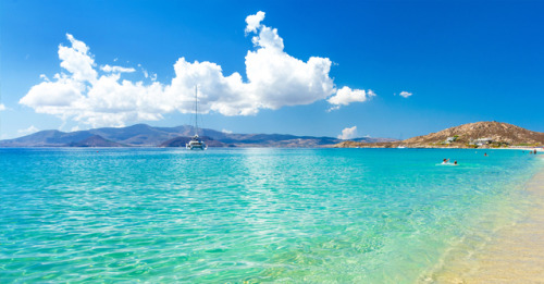 Dive into the light blue waters of NaxosEnjoy the Greek sun and sandy beaches.