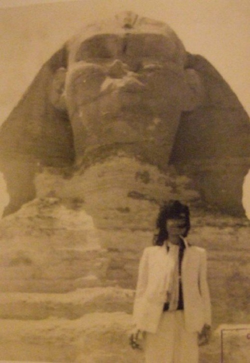 ritacaroline:the-four-perfections:jimmy in egypt.The Sphynx is standing behind a famous Icon.