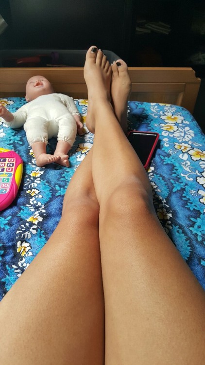 ladyfilth:  Relaxing while babysitting.   Sexy Belly, Nice Legs, Creepy Doll, Filthy Lady: http://ladyfilth.tumblr.com/