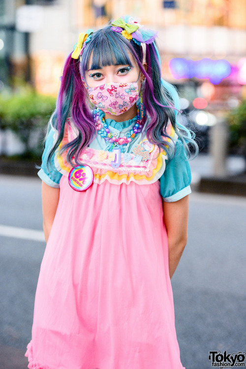 Kawaii Japanese street style personality Emiry on the street in Harajuku with colorful twin tails, a