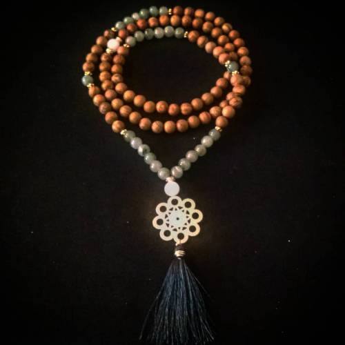 Jasper, green aventurine, snow quartz guru bead, sacred geometry, and a soft tassel. Aventurine is a