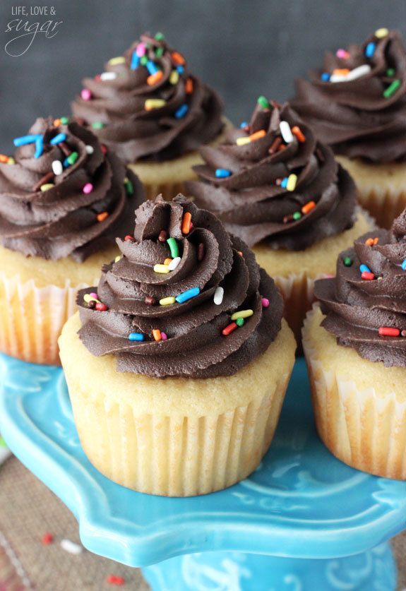 sweetoothgirl:  Yellow Cupcakes with Chocolate Frosting   
