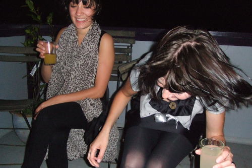 Partying girl in short skirt and black opaque pantyhose. Woman in pantyhose