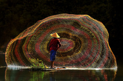 visitheworld:  Fisherman at work, Depok Lake,