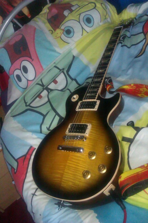 sirfloppychicken:  My guitar IS rather beautiful though… :)