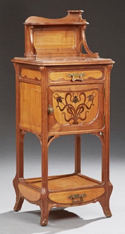 Circa 1920 Majorelle-style French mahogany inlaid art nouveau nightstand with a shelved back splash 
