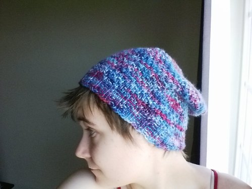 Hat complete; very pleased! Can hide the cable on androgynous days in the back fold, too, which is g