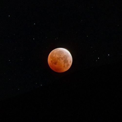 Lunar eclipse this morning, May 26, 2021, about to set below the horizon. Captured at Topaz Lake. fl