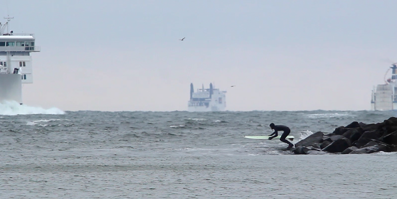 Staying close to the harbor entrance was key to catching the biggest wave possible.