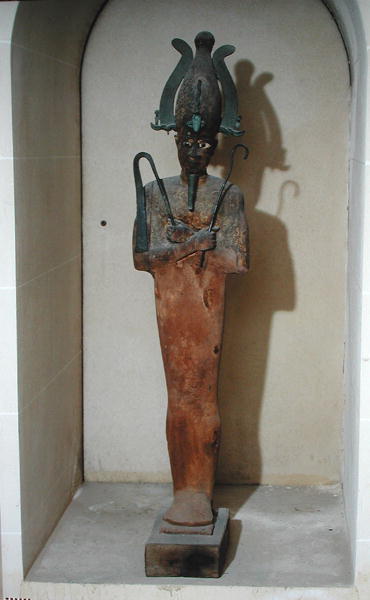 Statue of the Cult of OsirisPainted wood and bronze, 16.8 x 36 x 38 cms.Ptolemaic Period ca. 332-30 