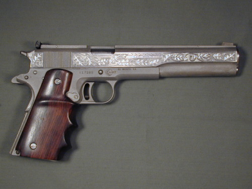 pimpingweapons:  Engraved long slide 1911 with wood grips
