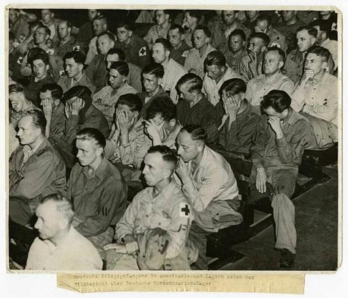 historicaltimes:  German prisoners of war in American camps see a film report about German concentra