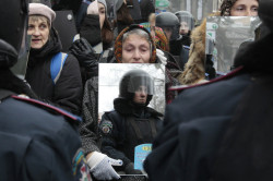 untrustyou:  FACE TO FACE: A demonstrator held a mirror to reflect police officers in Kiev, Ukraine, Monday Dec 30th. 2013. Opposition activists protested in the capital, continuing more than a month of rallies opposing the government’s decision to