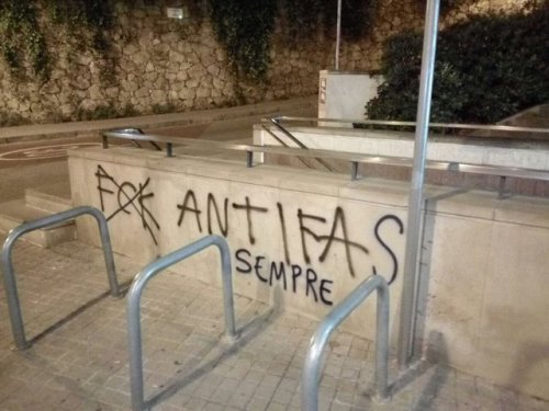 Antifascists fix up some nazi graffiti in Vallcarca, Barcelona