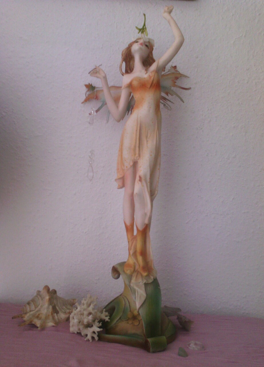 Offerings to faery Lenaia: bark, aqua marine,quarz,coral,flower,wand made with stem,shell.