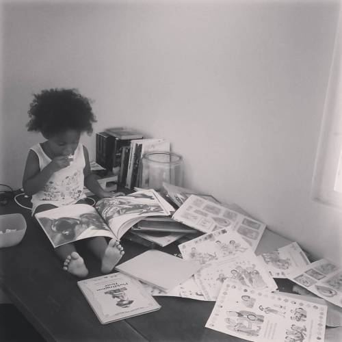 At least 2x a day she will sit on the table and going through all of her books #readingisFUN #blac