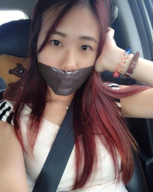 Asian girl fake tape gagged