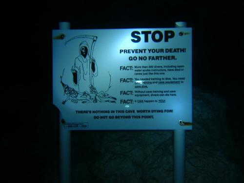 sixpenceee:This underwater cave warning side is at the bottom of Jacob’s Well in Texas. You can read