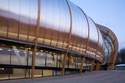 archatlas:  Limoges Concert Hall Bernard Tschumi Architects “The concept for the project began with a double envelope: an outer skin made of wood arcs and translucent rigid polycarbonate sheets and an inner acoustical envelope of locally grown