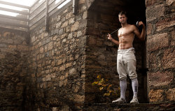 modernfencing:[ID: four photos of an epee fencer in a forest and at a castle, sometimes shirtless.]Benjamin Steffen!