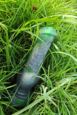 And here we see the Tucker in it’s alternate natural environment - cushioned gently against the grass, where it spends its time when not pounding ass. As you can see, the shaft stays solid and firm in order to brush more heavily against any nearby